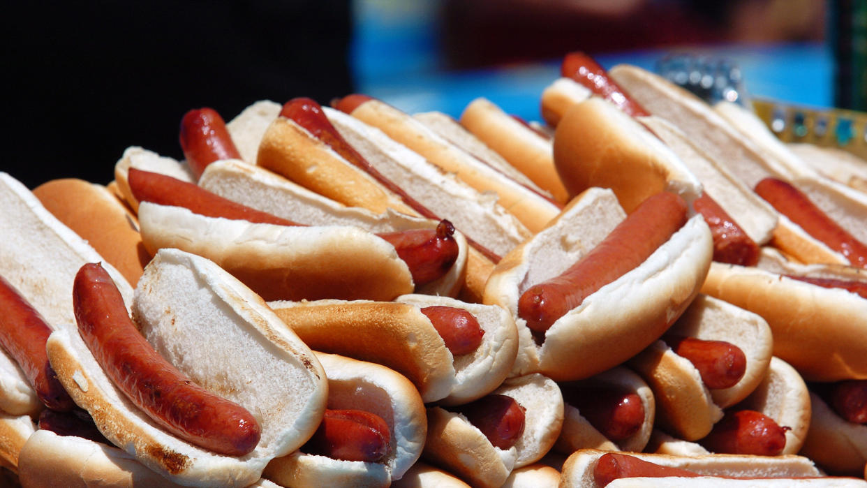  Hot dogs piled atop a platter await consumption at the Nathan's Hot Dog Eating Contest live stream 