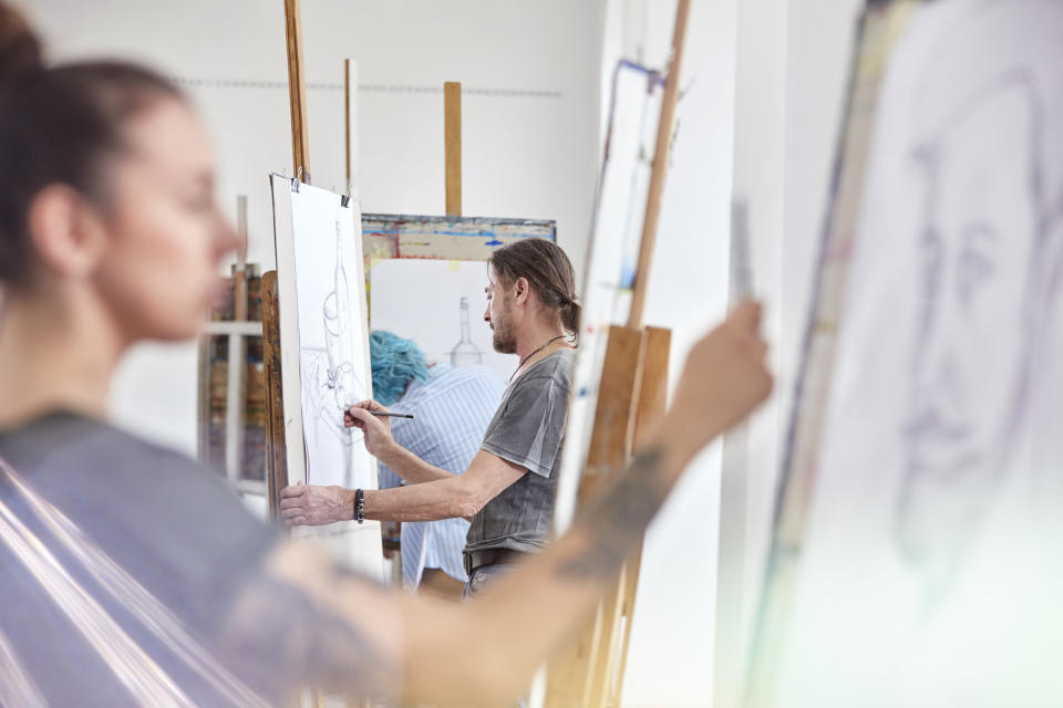 Students drawing in an art class