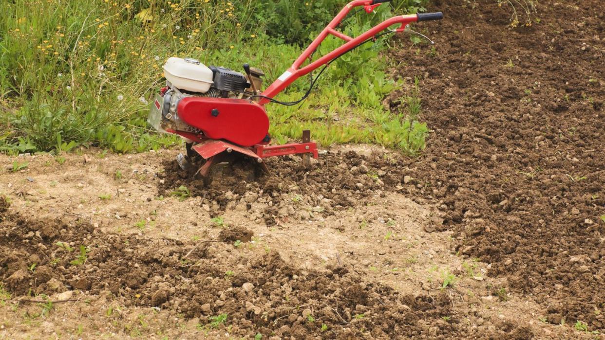 a motor hoe in a partly ploughed field