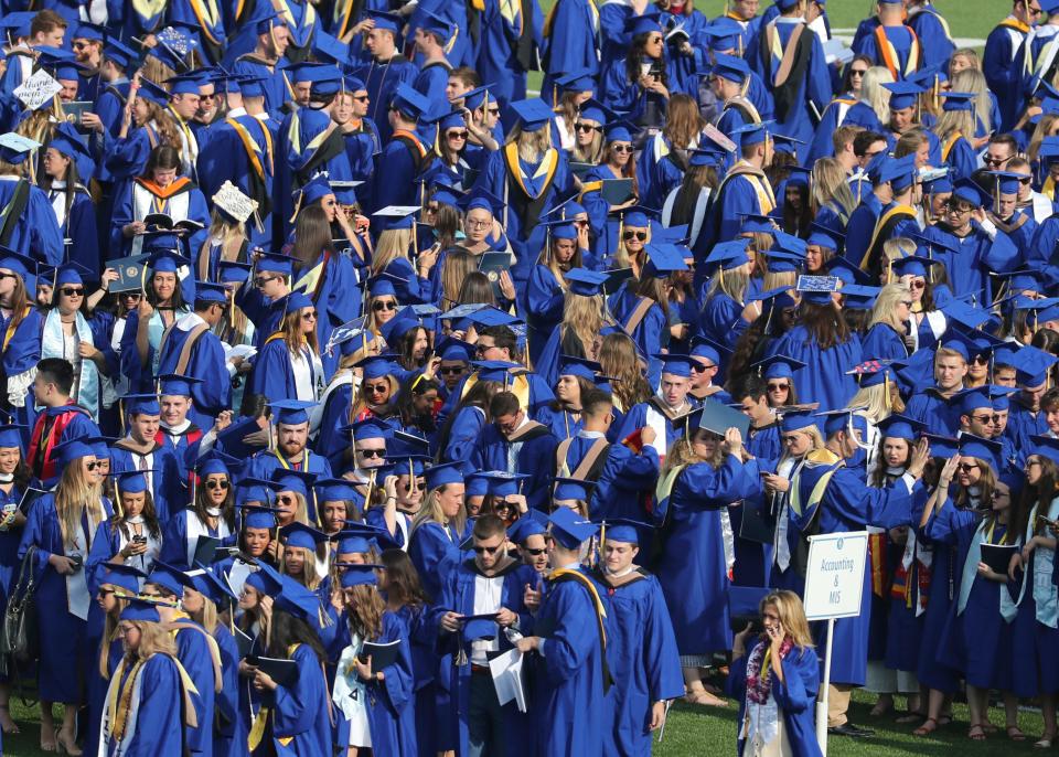Students stage before the University of Delaware hosts commencement ceremonies for approximately 6,200 graduates at Delaware Stadium Saturday.