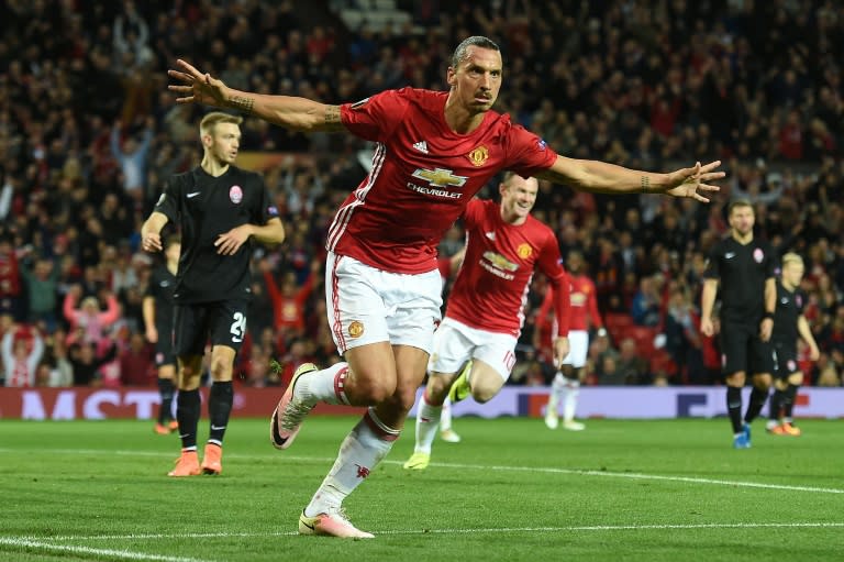 Manchester United's Zlatan Ibrahimovic (C) celebrates after scoring a goal during their UEFA Europa League Group A match against Zorya Luhansk, at Old Trafford in Manchester, on September 29, 2016