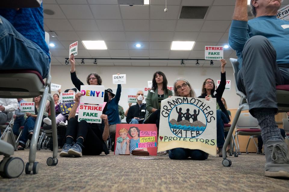 Protestors and visitors fill the room during a meeting that was held by the Oil and Gas Land Management Commission to determine whether to let private companies bid for contracts on different parcels of land in Ohio.