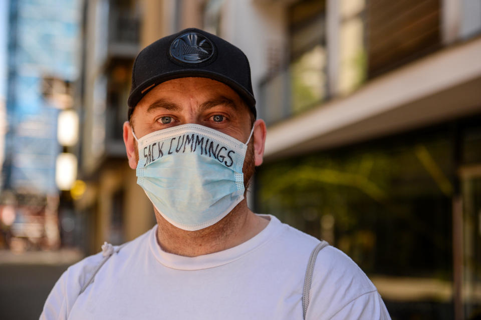 A person wearing a PPE face mask proclaiming 'SACK CUMMINGS', as calls grow for Prime Minister Boris Johnson's chief SPAD, Dominic Cummings, to be sacked from his position for flouting the lockdown rules he helped to create, on 25th May 2020 in Manchester, UK. (Photo by Pat Scaasi/MI News/NurPhoto via Getty Images)