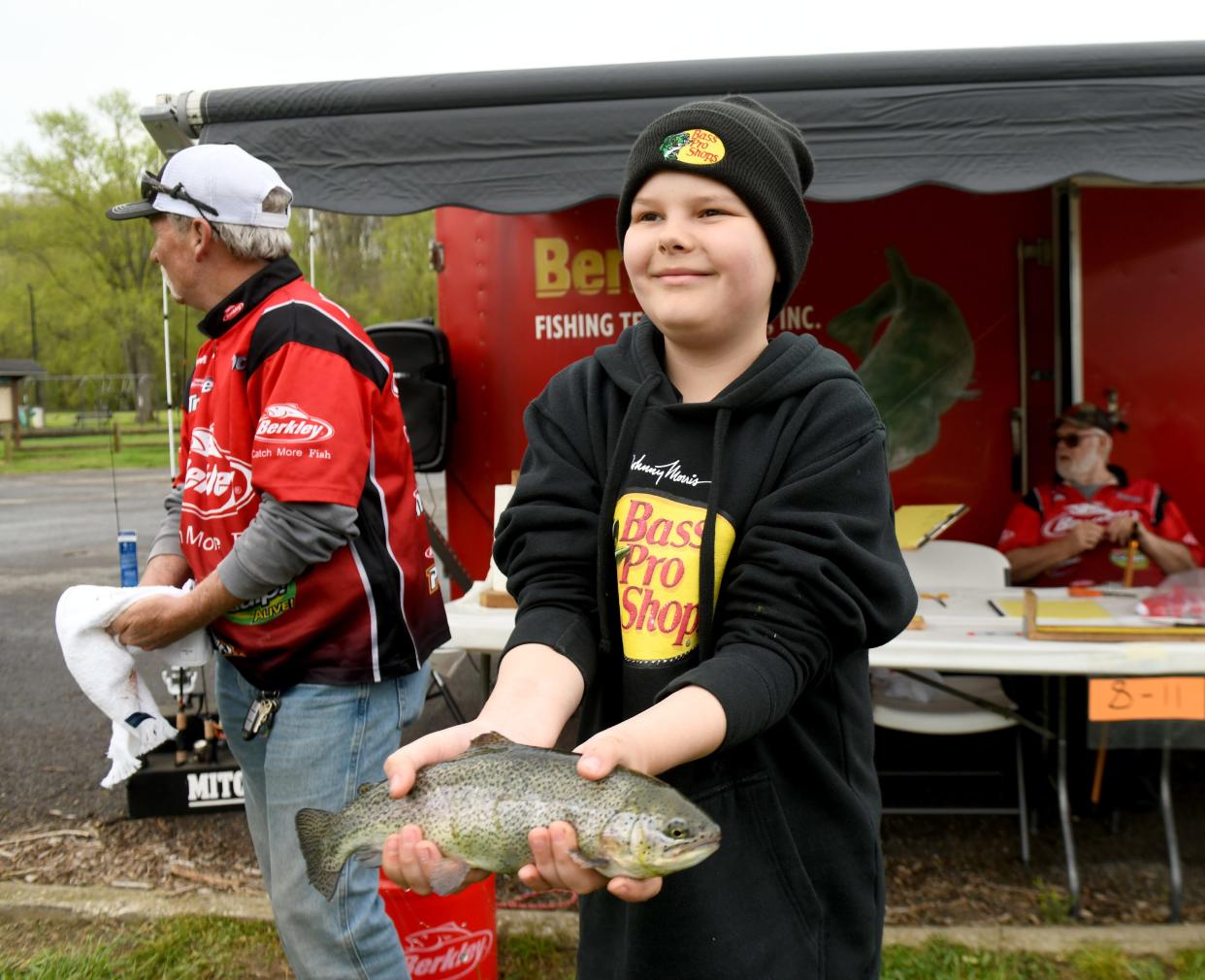 Isaak Jack, 12, of Canal Fulton shows off his catch during The Jack Cullen Towpath Trail Trout Derby at St. Helena Heritage Park in Canal Fulton.