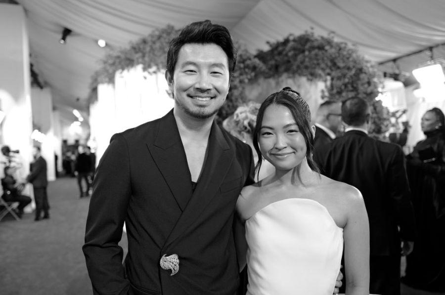 HOLLYWOOD, CALIFORNIA – MARCH 10: (L-R) (EDITORS NOTE: Image was shot in black and white, color version available) Simu Liu and Allison Hsu attend the 96th Annual Academy Awards on March 10, 2024 in Hollywood, California. (Photo by Emma McIntyre/Getty Images)