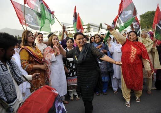 Women activists of the ruling Pakistan People's Party (PPP) dance as they celebrate the election of Raja Pervez Ashraf as Pakistan's new prime minister outside the lower house of parliament in Islamabad