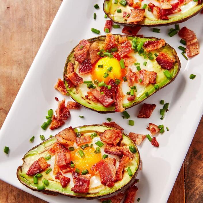 <p><a href="https://www.delish.com/cooking/recipe-ideas/recipes/a57655/stuffed-avocados-3-ways-recipe/" rel="nofollow noopener" target="_blank" data-ylk="slk:Stuffed avocados" class="link ">Stuffed avocados</a> are our favorite way to eat the power fruit. It's creamy texture pairs perfectly with a just-set egg and crispy bacon.<br><br>Get the <strong><a href="https://www.delish.com/cooking/recipe-ideas/recipes/a45382/avocado-egg-boats-recipe/" rel="nofollow noopener" target="_blank" data-ylk="slk:Avocado Egg Boats recipe" class="link ">Avocado Egg Boats recipe</a></strong>. </p>