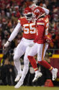 Kansas City Chiefs defensive end Frank Clark (55) celebrates with teammate cornerback Trent McDuffie (21) after sacking Cincinnati Bengals quarterback Joe Burrow during the first half of the NFL AFC Championship playoff football game, Sunday, Jan. 29, 2023, in Kansas City, Mo. (AP Photo/Ed Zurga)