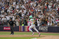 San Diego Padres' Fernando Tatis Jr. runs the bases after hitting a solo home run agains the San Francisco Giants during the fifth inning of a baseball game at Alfredo Harp Helu Stadium in Mexico City, Saturday, April 29, 2023. (AP Photo/Fernando Llano)
