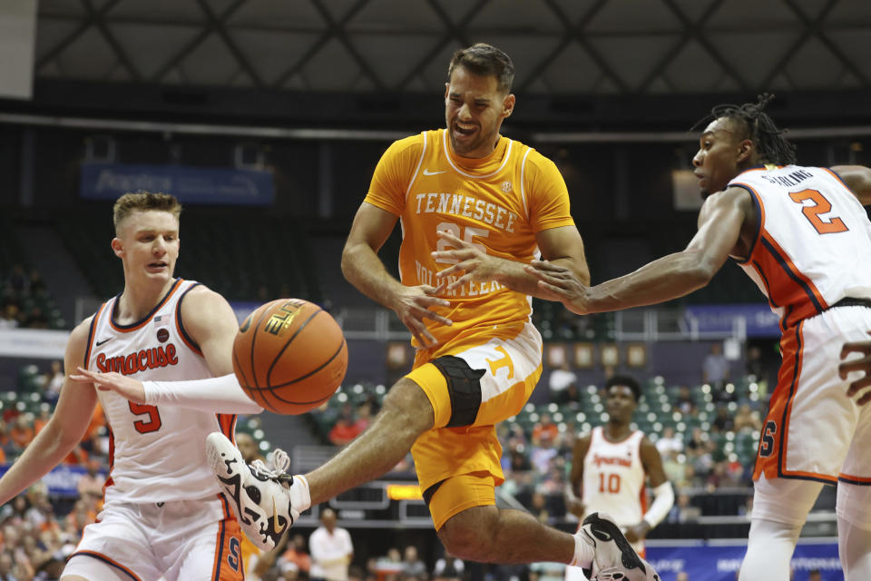 Syracuse guard JJ Starling (2) fouls Tennessee guard Santiago Vescovi during the second half of an NCAA college basketball game, Monday, Nov. 20, 2023, in Honolulu. (AP Photo/Marco Garcia)