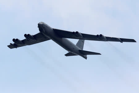 FILE PHOTO: A Boeing B-52 Stratofortress strategic bomber from the US Air Force Andersen Air Force Base in Guam performs a fly-over at the Singapore Airshow in Singapore February 14, 2012. REUTERS/Tim Chong//File Photo
