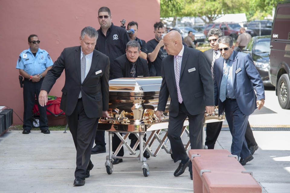 The casket with the remains of Mexican singer Jose Jose is wheeled into the Miami Dade County Auditorium for a public viewing Sunday, October 6, 2019 in Miami. (AP Photo/Gaston De Cardenas)