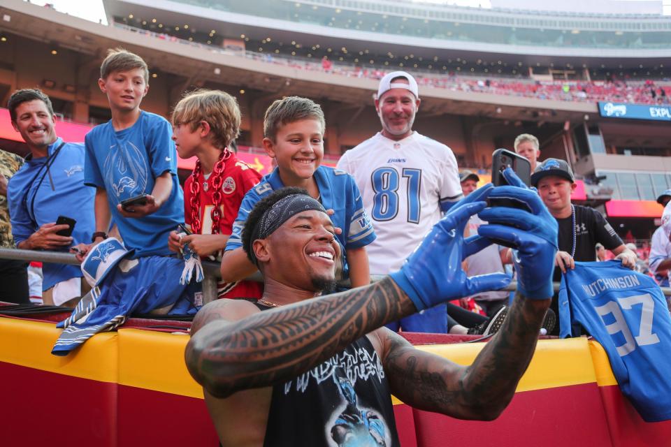 Detroit Lions wide receiver Marvin Jones Jr. (0) takes a selfie with fans during warmup ahead of the season opener against the Kansas City Chiefs at Arrowhead Stadium in Kansas City, Mo. on Thursday, Sept. 7, 2023.