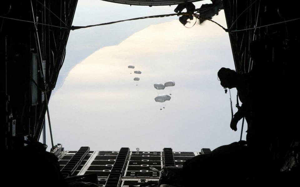 Aid is air-dropped over Gaza in cooperation with France in this handout picture released on February 26, 2024.