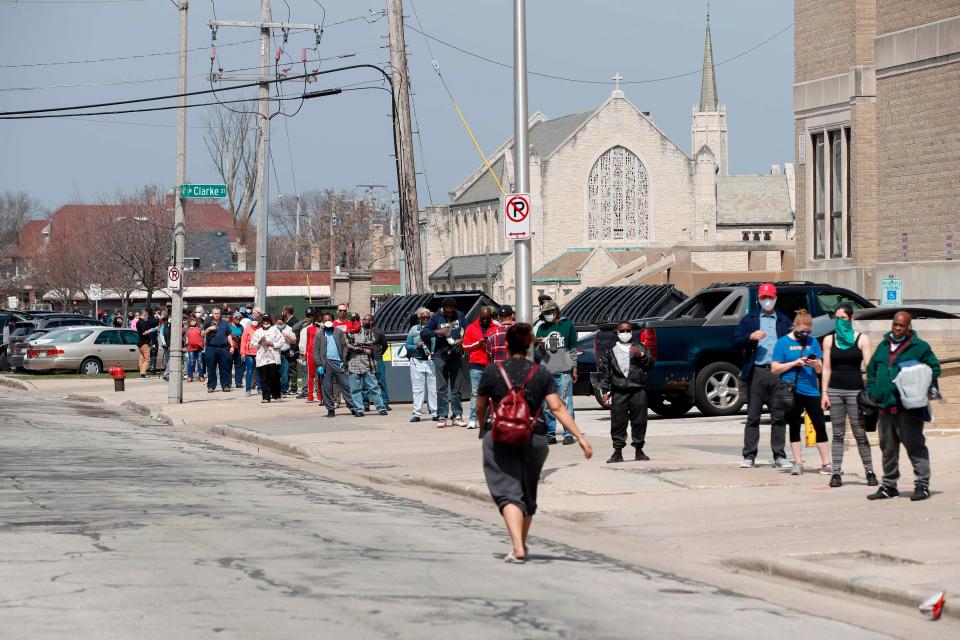 Milwaukee, Wis., residents wait in long line to vote in a presidential primary election outside the Riverside High School on April 7, 2020. Democratic officials had sought to postpone the election but were overruled by state Supreme Court, and the U.S. Supreme Court stepped in to bar an extension of voting by mail that would have allowed more people to cast ballots without going to polling stations.