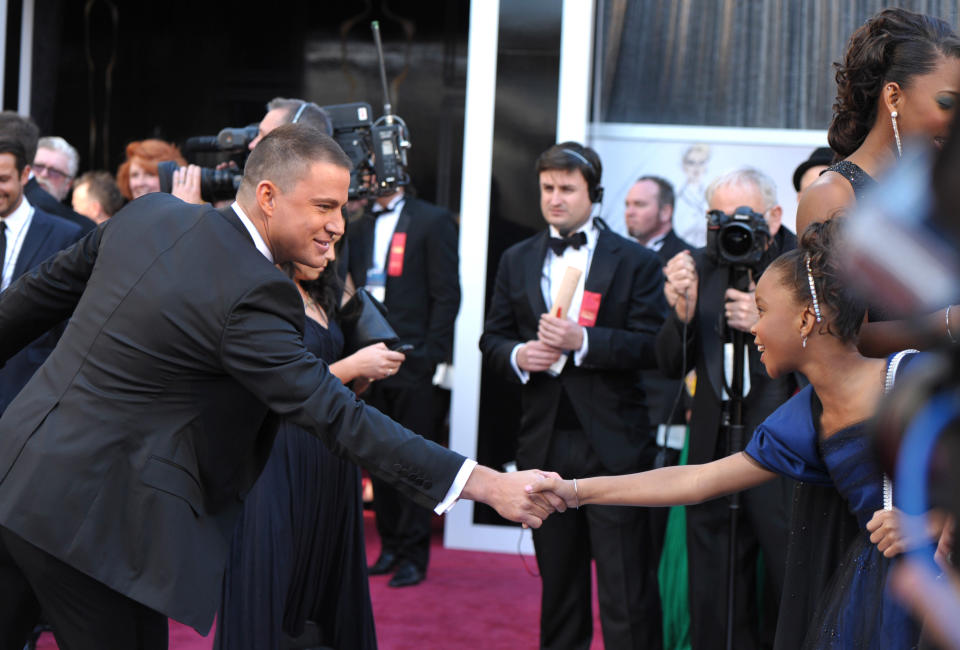 Actors Channing Tatum, left, and Quvenzhane Wallis greet each other as they arrive at the 85th Academy Awards at the Dolby Theatre on Sunday Feb. 24, 2013, in Los Angeles. (Photo by John Shearer/Invision/AP)