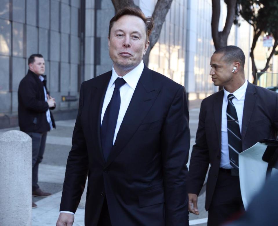 Elon Musk leaves the courthouse on the fourth day of the trial of Tesla shareholders lawsuit.