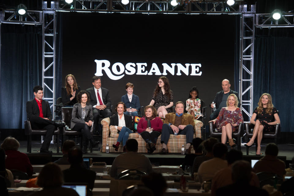 Roseanne Barr sits front and center with the cast of her&nbsp;now-canceled reboot, "Roseanne." (Photo: Image Group LA via Getty Images)