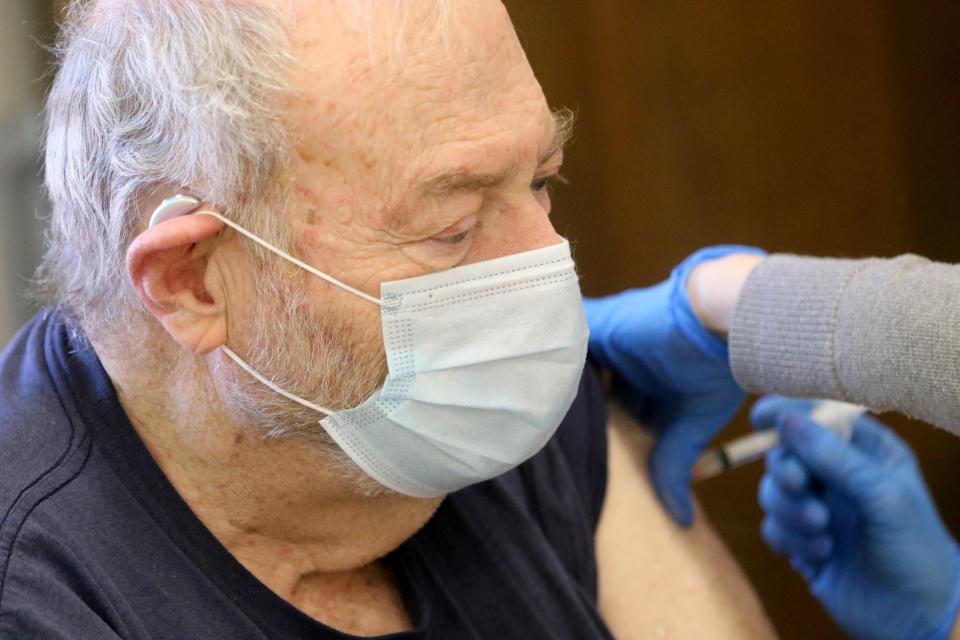 Joe Sommers receives the Moderna COVID-19 vaccine in Hackensack, N.J., on March 3.