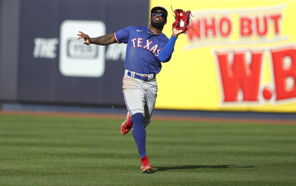 Texas Rangers right fielder Adolis Garcia catches a ball for an out against the New York Yankees during the seventh inning of a baseball game, Saturday, June 24, 2023, in New York. (AP Photo/Noah K. Murray)