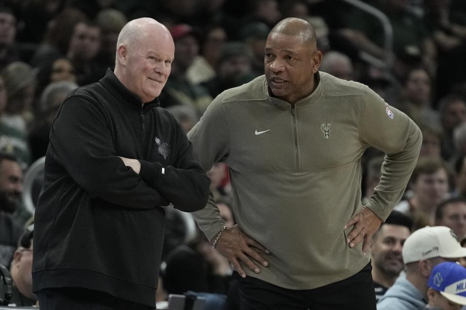 Milwaukee Bucks head coach Doc Rivers talks to Charlotte Hornets head coach Steve Clifford during the second half of an NBA basketball game Friday, Feb. 9, 2024, in Milwaukee. (AP Photo/Morry Gash)