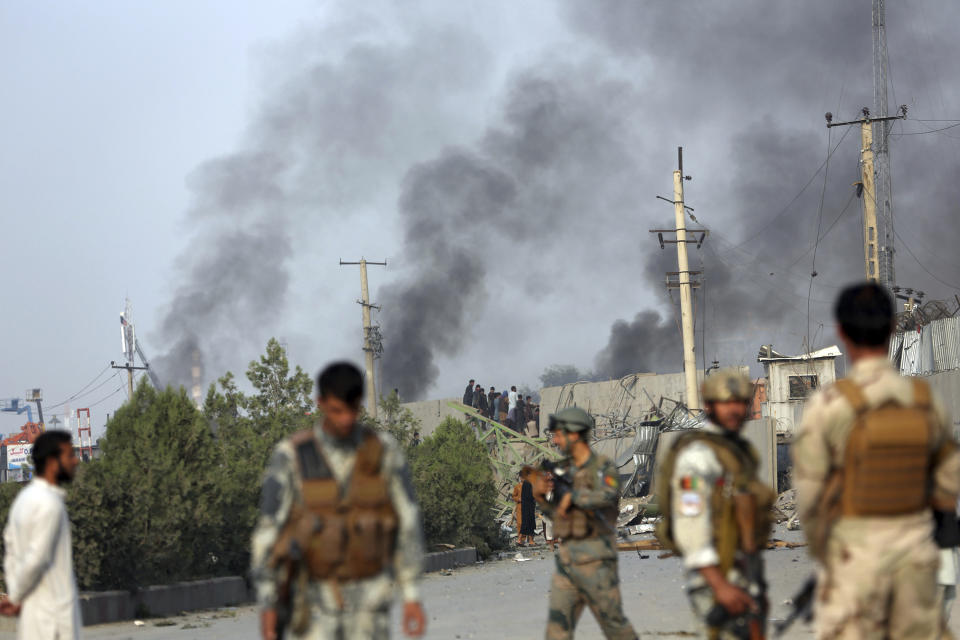 Smoke billows from the Green Village, home to several international organizations and guesthouses, in Kabul, Afghanistan, Tuesday, Sept. 3, 2019. Angry residents climbed into the international compound that had been targeted and set part of it on fire. (AP Photo/Rahmat Gul)