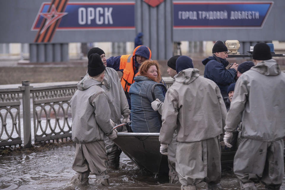 Emergency workers use a boat to evacuate local residents in a flooded street after a part of a dam burst, in Orsk, Russia on Monday, April 8, 2024. Floods caused by rising water levels in the Ural River broke a dam in a city near Russia's border with Kazakhstan, forcing some 2,000 people to evacuate, local authorities said. The dam broke in the city of Orsk in the Orenburg region, less than 12.4 miles north of the border on Friday night, according to Orsk mayor Vasily Kozupitsa. (AP Photo)