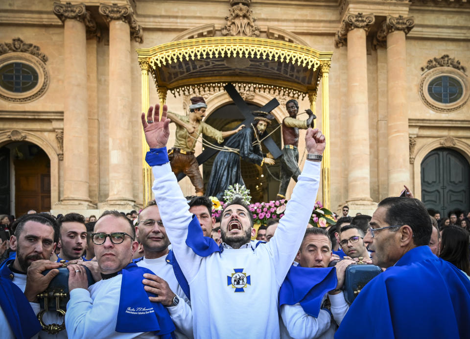 Christians participate in a Good Friday procession in front of the Basilica of the Santissima Annunziata on April 19, 2019 in Ispica, Italy.  (Fabrizio Villa via Getty Images)