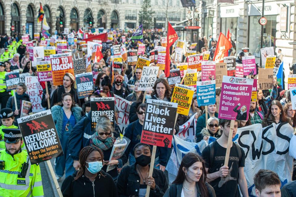 <span class="caption">Thousands of protesters march on World Anti-Racism Day on March 19, 2022, in London.</span> <span class="attribution"><a class="link " href="https://www.gettyimages.com/detail/news-photo/thousands-of-protestors-march-from-the-bbc-building-in-news-photo/1386503532?adppopup=true" rel="nofollow noopener" target="_blank" data-ylk="slk:Guy Smallman/Getty Images;elm:context_link;itc:0;sec:content-canvas">Guy Smallman/Getty Images</a></span>