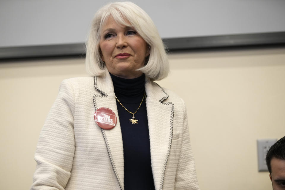 Candidate for the Colorado Republican Party chair position Tina Peters concludes her speech during a debate sponsored by the Republican Women of Weld, Saturday, Feb. 25, 2023, in Hudson, Colo. (AP Photo/David Zalubowski)