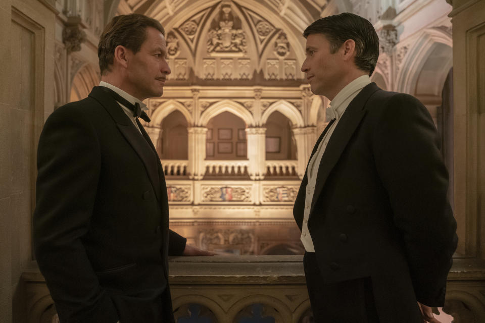 This image released by Focus Features shows Dominic West as Guy Dexter and Robert James Collier as Thomas Barrow in a scene from "Downton Abbey: A New Era." (Ben Blackall/Focus Features via AP)