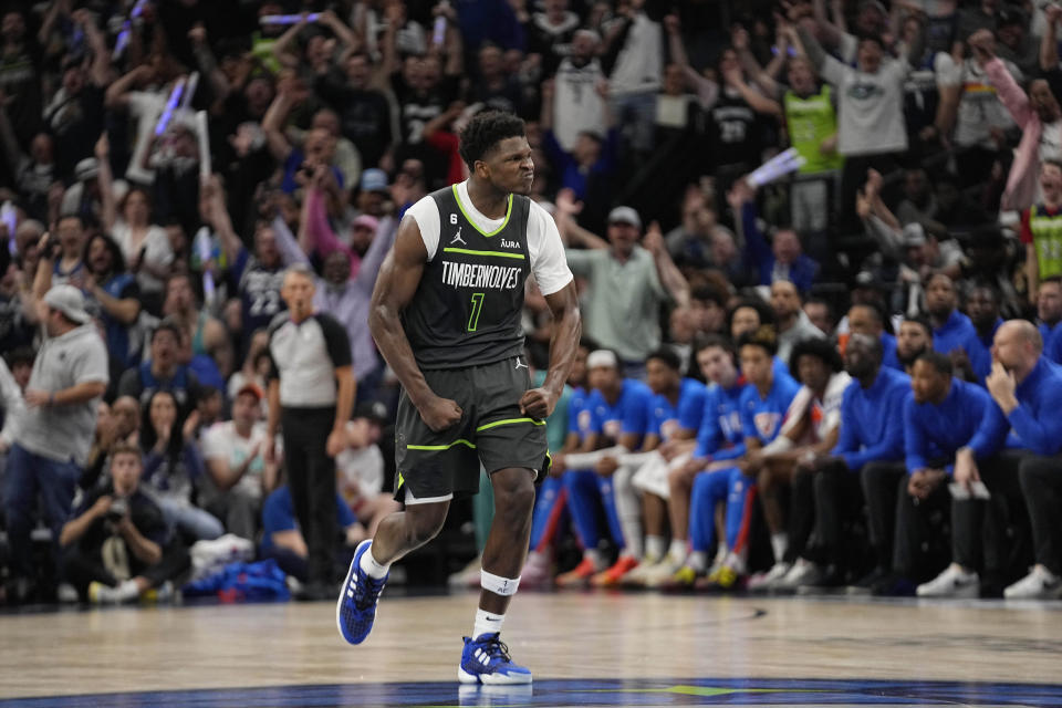 Minnesota Timberwolves guard Anthony Edwards celebrates after making a 3-point basket during the second half of the team's NBA basketball play-in tournament game against the Oklahoma City Thunder, Friday, April 14, 2023, in Minneapolis. (AP Photo/Abbie Parr)