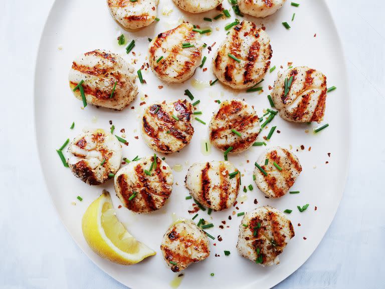 <p>Scallops will make you feel fancy no matter what—and they're so easy to grill. When seasoned with some salt, pepper, and chilli flakes, they're pure gold. Oh, and did we mention they take 5 minutes? And they taste great in this <a href="https://www.delish.com/uk/cooking/recipes/a30684940/seafood-pasta-recipe/" rel="nofollow noopener" target="_blank" data-ylk="slk:Seafood Spaghetti;elm:context_link;itc:0;sec:content-canvas" class="link ">Seafood Spaghetti </a>recipe we have.</p><p>Get the <a href="https://www.delish.com/uk/cooking/recipes/a32821279/best-grilled-scallops-recipe/" rel="nofollow noopener" target="_blank" data-ylk="slk:Grilled Scallops;elm:context_link;itc:0;sec:content-canvas" class="link ">Grilled Scallops</a> recipe.</p>