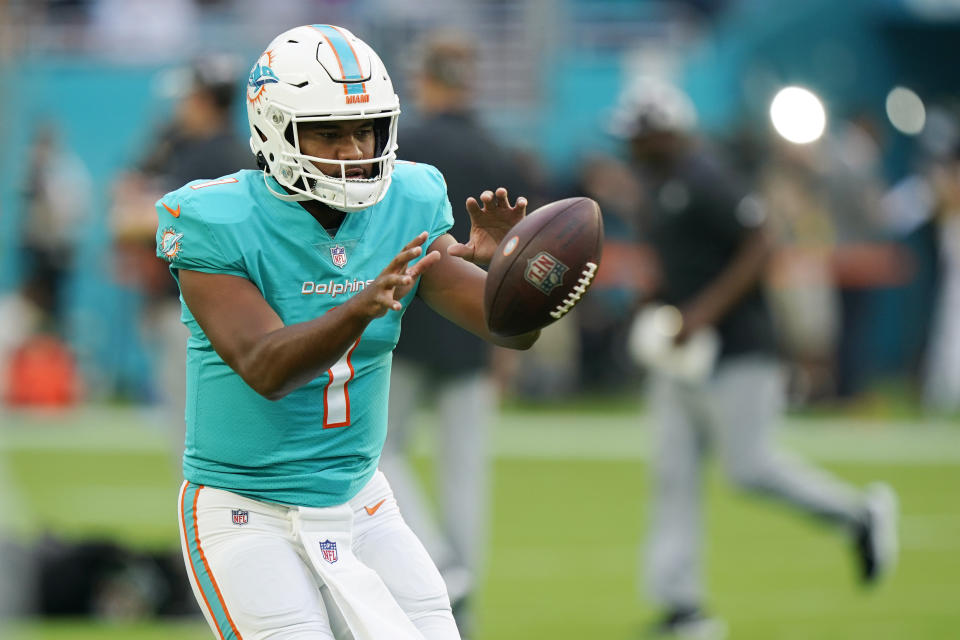 Miami Dolphins quarterback Tua Tagovailoa (1) warms up before a NFL preseason football game against the Las Vegas Raiders, Saturday, August 20, 2022, in Miami Gardens, Fla. (AP Photo/Wilfredo Lee)