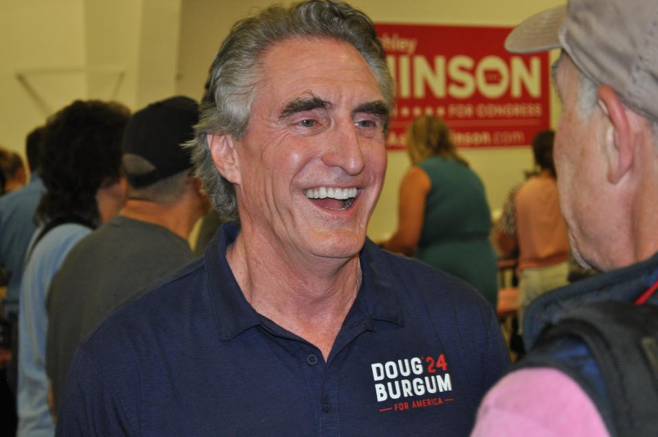 North Dakota governor Doug Burgum is a candidate for the 2024 Republican presidential nomination. He stresses his small town background as he campaigns in Iowa, saying Washington, D.C., needs “more understanding of what’s going on in America and small towns.”