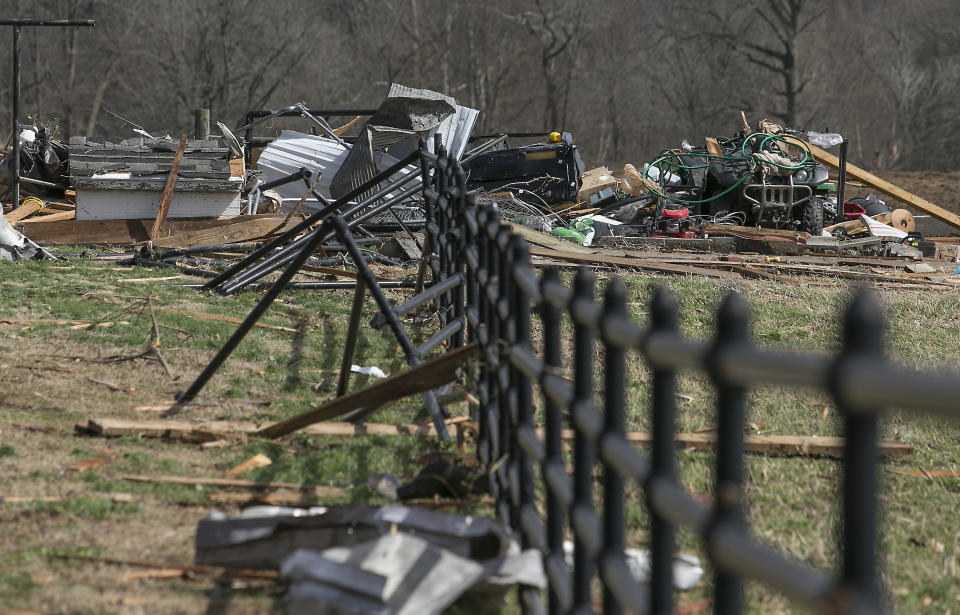 Debris and damaged farm equipment is seen after a tornado hit a barn in McCracken County, Ky., on Thursday, March 14, 2019. (Ellen O'Nan/The Paducah Sun via AP)