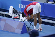 Novak Djokovic, of Serbia, reacts during the bronze medal match of the tennis competition against Pablo Carreno Busta, of Spain, at the 2020 Summer Olympics, Saturday, July 31, 2021, in Tokyo, Japan. (AP Photo/Seth Wenig)