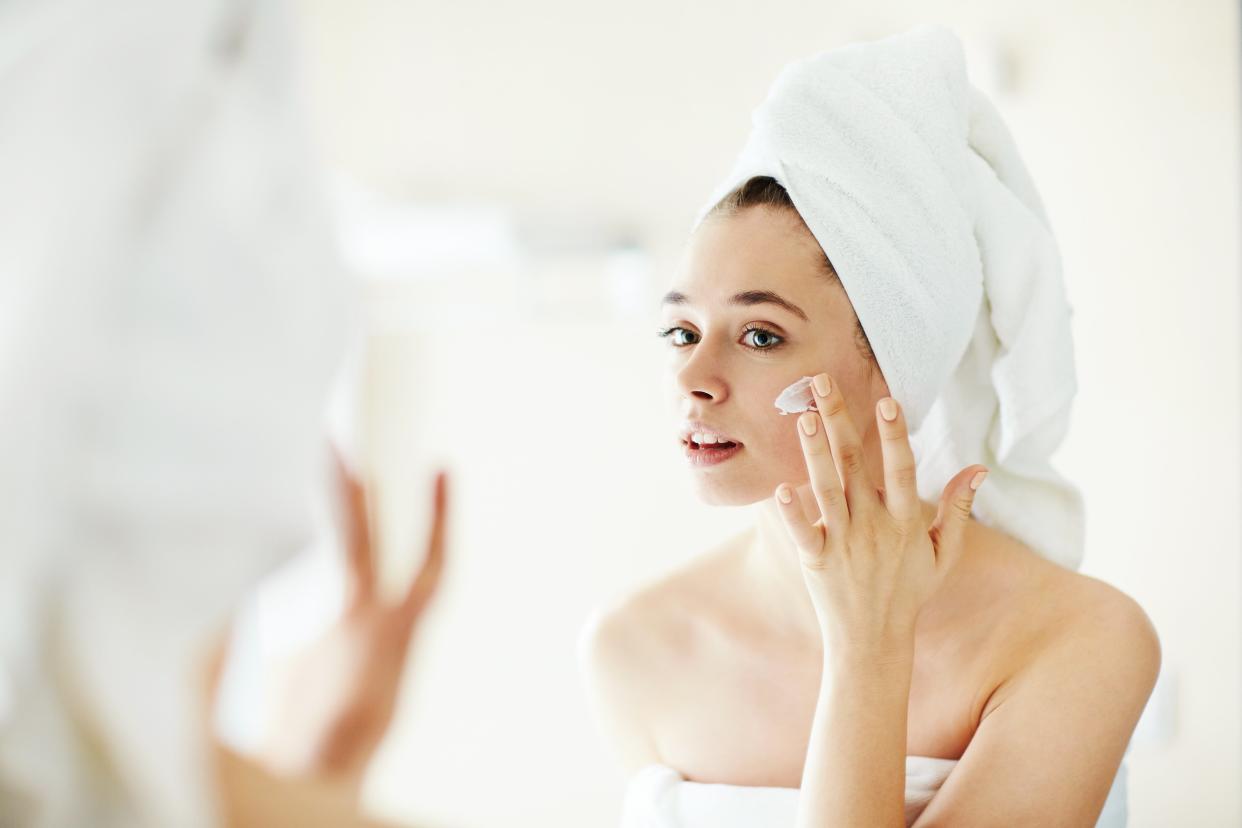 woman applying face cream