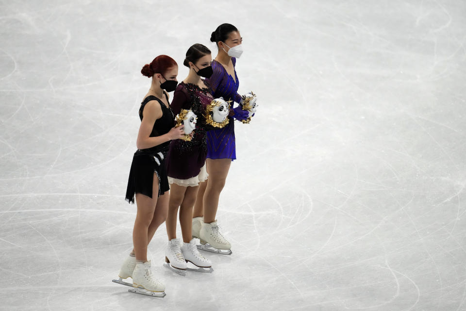 From left, silver medalist, Alexandra Trusova, of the Russian Olympic Committee, gold medalist, Anna Shcherbakova, of the Russian Olympic Committee, and bronze medalist, Kaori Sakamoto, of Japan, pose during a venue ceremony after the women's free skate program during the figure skating competition at the 2022 Winter Olympics, Thursday, Feb. 17, 2022, in Beijing. (AP Photo/Natacha Pisarenko)