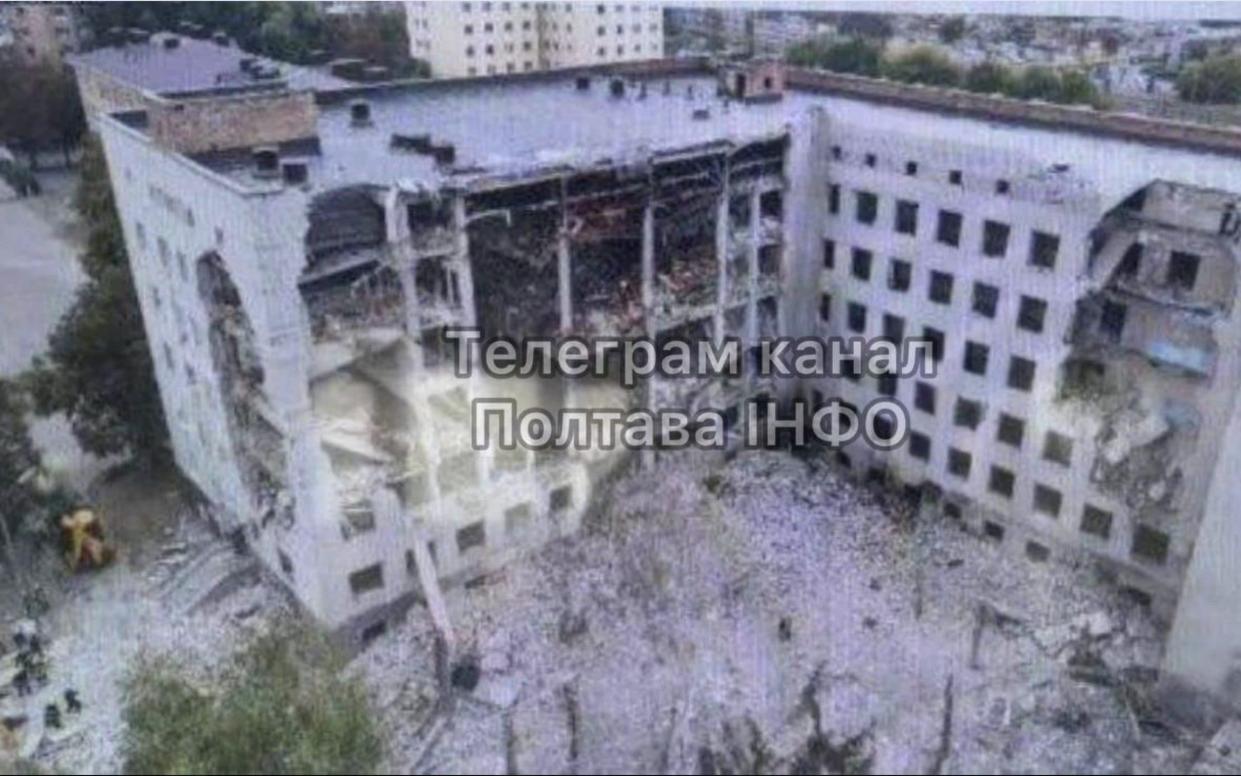 An entire exterior wall of the seven-storey building has been removed and lies in rubble beneath it