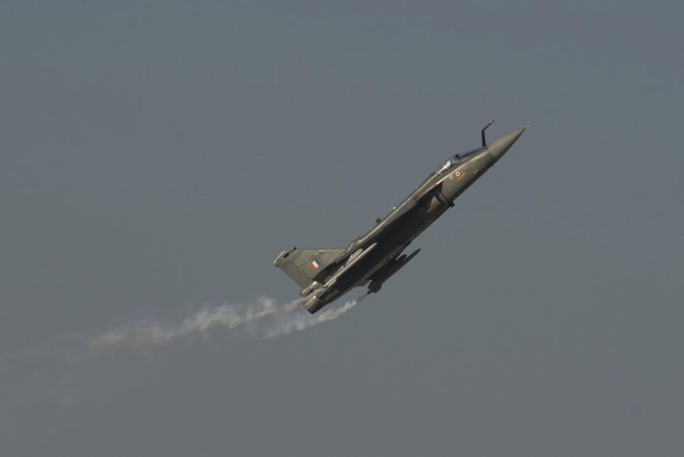 An Indian Air Force HAL Tejas flies at the Dubai Air Show in Dubai, United Arab Emirates, Monday, Nov. 13, 2023. Long-haul carrier Emirates opened the Dubai Air Show with a $52 billion purchase of Boeing Co. aircraft, showing how aviation has bounced back after the groundings of the coronavirus pandemic, even as Israel's war with Hamas clouds regional security. (AP Photo/Jon Gambrell)