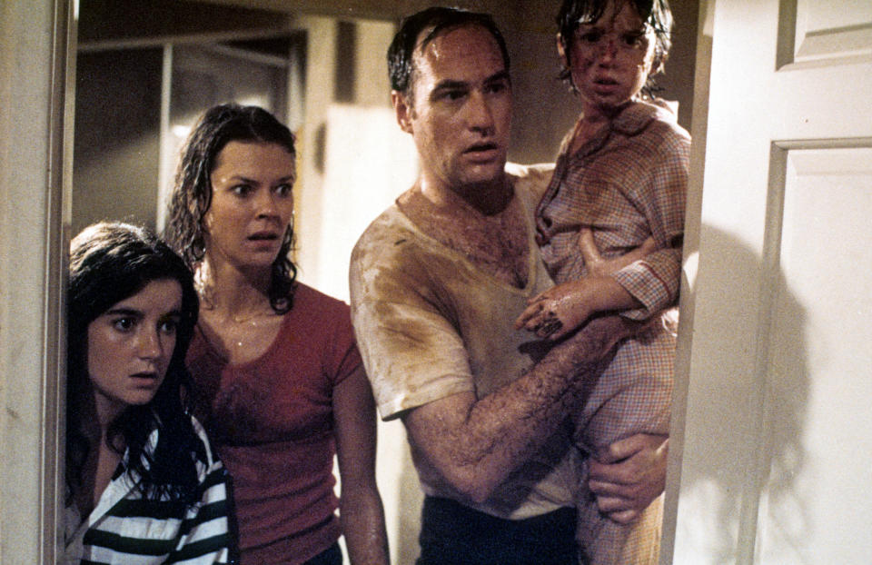 JoBeth Williams looks on as Craig T Nelson holds Oliver Robins in a scene from the film &#39;Poltergeist&#39;, 1982. (Photo by Metro-Goldwyn-Mayer/Getty Images)