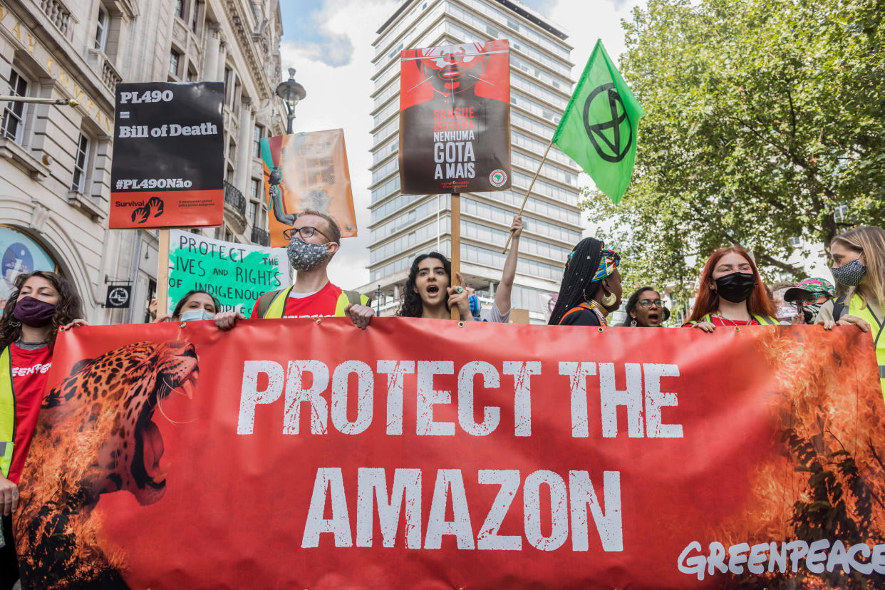  Protesters hold a banner expressing their opinions during the demonstration.
On the 3rd day of Extinction Rebellion's protests, protesters came together with the aim of demanding climate justice for the Indigenous people of Amazon rainforests in Brazil. They protest against ecocide and deforestation in Brazil. The group began their demonstration outside Brazilian Embassy in London, then moved over to Piccadilly Circus, and lastly occupying Oxford Circus. (Photo by Belinda Jiao / SOPA Images/Sipa USA) 