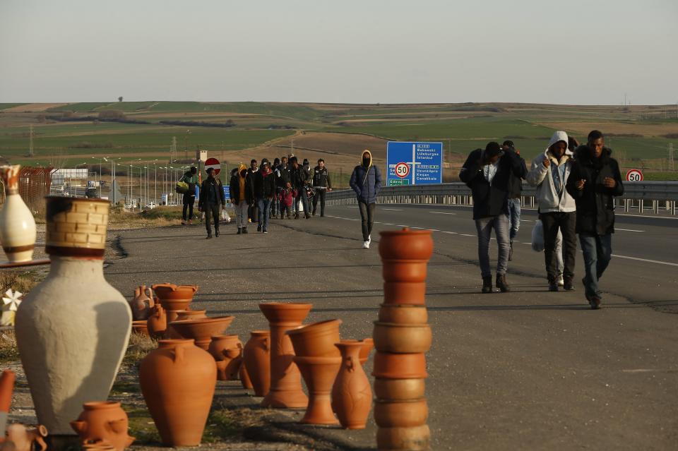 Migrants walk in Edirne, near the Turkish-Greek border on Friday, March 6, 2020. Thousands of refugees and other asylum-seekers have tried to enter Greece from the land and sea in the week since Turkey declared its previously guarded gateways to Europe open. (AP Photo/Emrah Gurel)