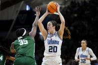 Villanova's Maddy Siegrist (20) looks to pass over Cleveland State's Amele Ngwafang during the second half of a first-round college basketball game in the NCAA Tournament, Saturday, March 18, 2023, in Villanova, Pa. (AP Photo/Matt Rourke)