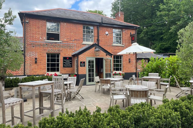 The Brickmakers - red brick pub with patio and chairs