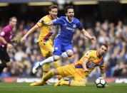 <p>Chelsea’s Cesc Fabregas in action with Crystal Palace’s Luka Milivojevic </p>