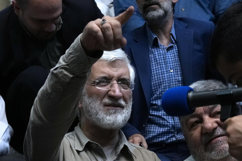 Iranian presidential candidate Saeed Jalili, a hard-line former nuclear negotiator, gestures while meeting with a group of athlete supporters during a campaign stop at a sports hall in Tehran, Iran, Sunday, June 30, 2024. (AP Photo/Vahid Salemi)