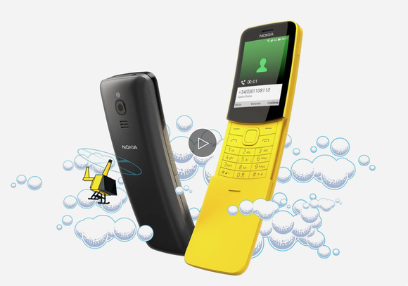 A new Nokia 8110 pictured in yellow and black. The keyboard is hidden behind a slide panel on the lower half of the phone.