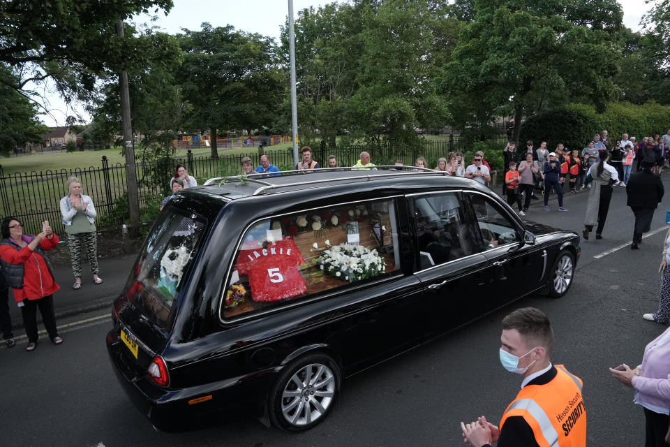 People line the streets as the funeral cortege of Jack Charlton passes through his hometown of Ashington, in Northumberland ahead of his funeral service at West Road Crematorium, in Newcastle. The former Republic of Ireland manager, who won the World Cup, playing for England, died on July 10 aged 85.